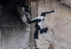 Мурал на Бенкси од гимнастичарка поставен на гранатирана зграда во Украина
